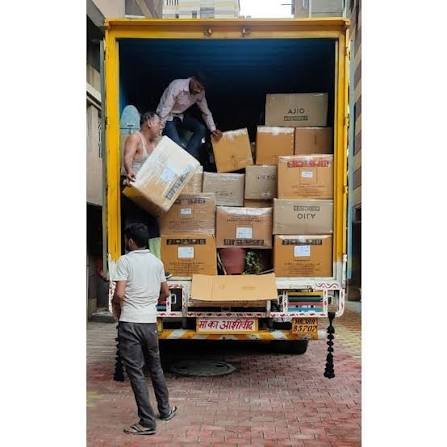 Two movers carrying boxes downstairs