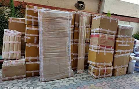 Cartons labelled room-wise with inventory tags